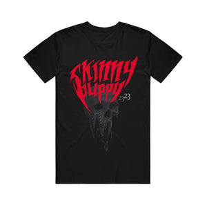 black tshirt on a white background. The shirt says Skinny Puppy in red letters and below that is a grey skull that is dripping by the mouth. Next to that are the numbers 23, 23 in grey.